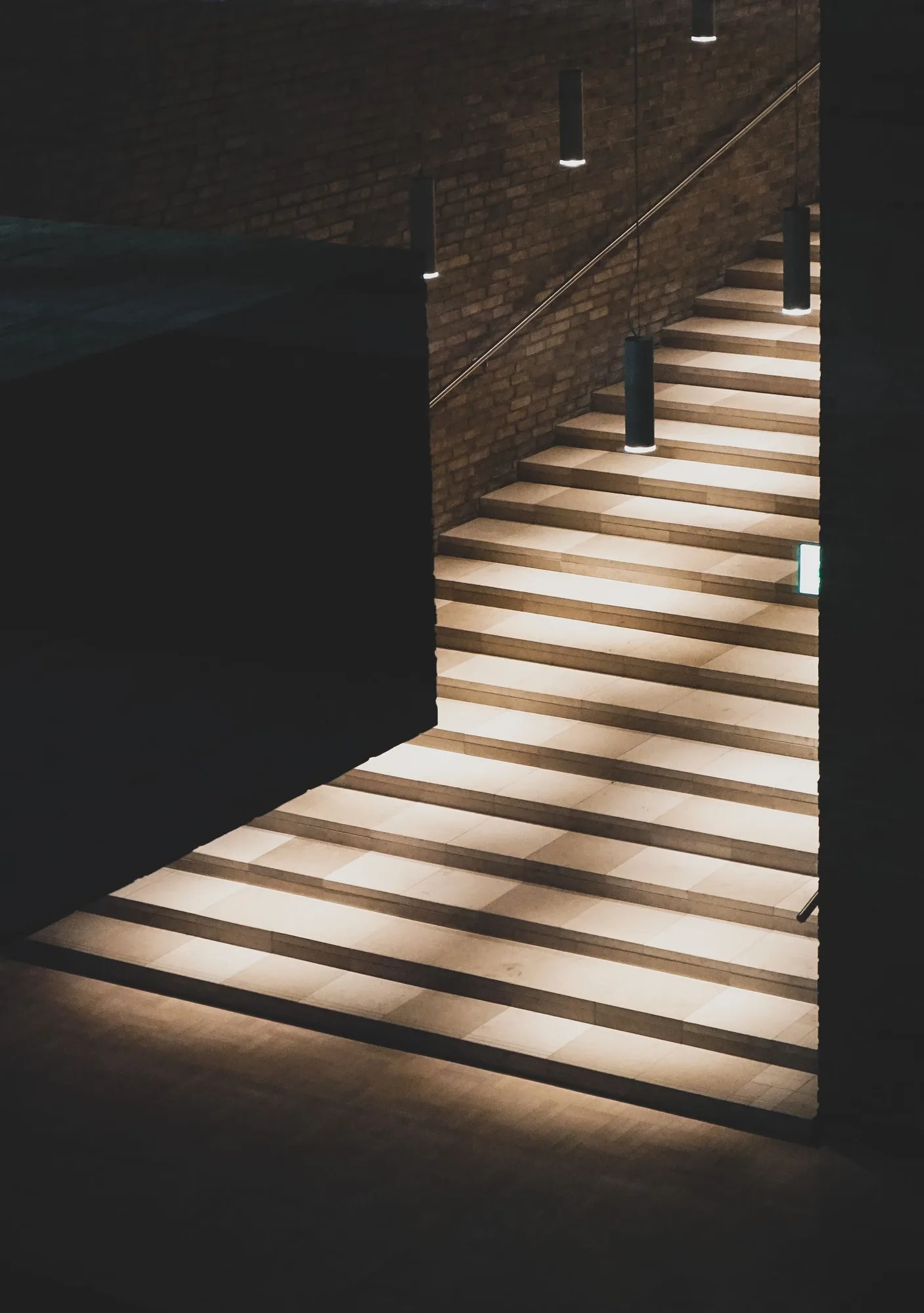 Architectural steps shaped by directional light and deep shadow.