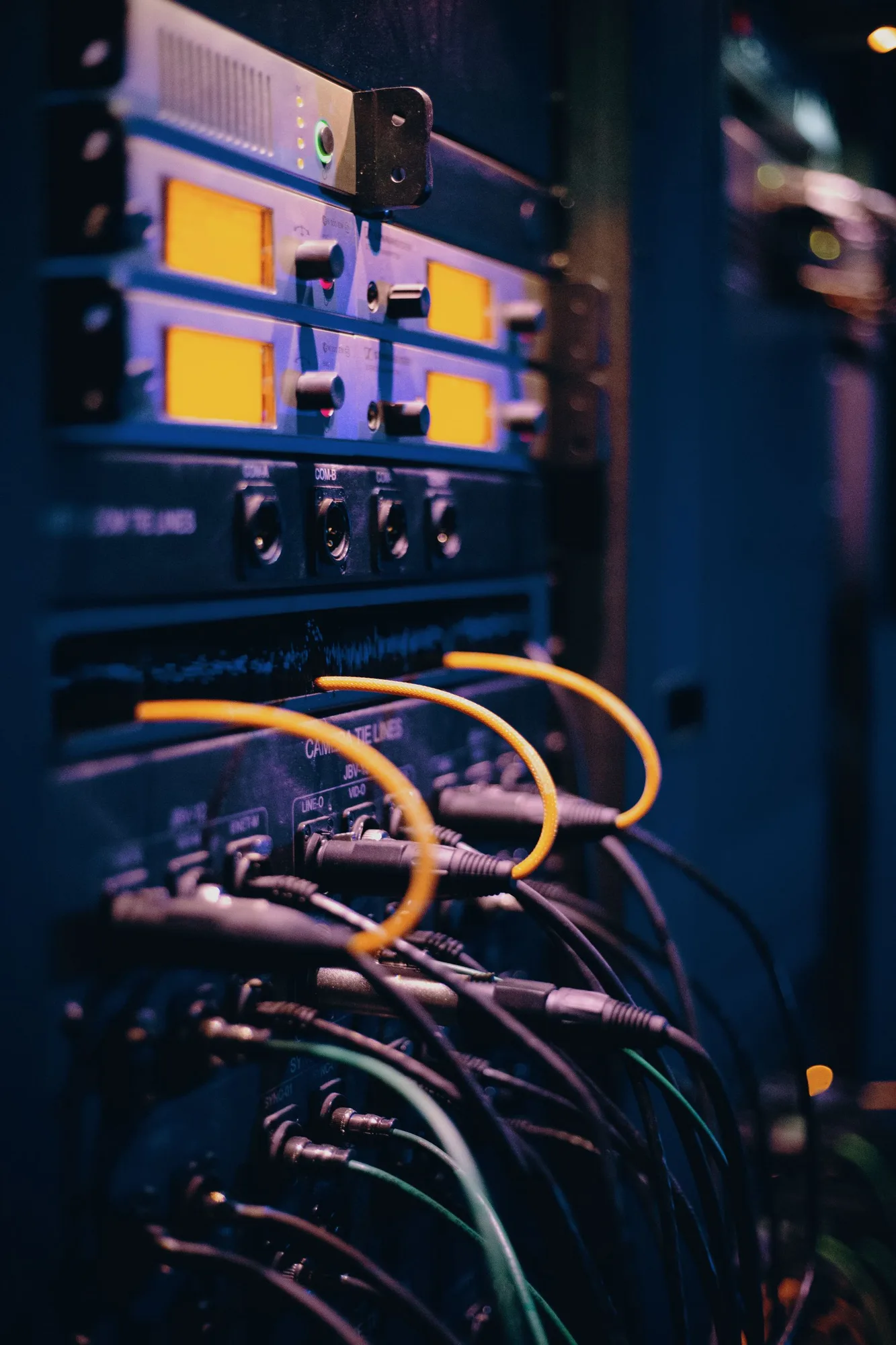 Network cables connected to ports in a server rack