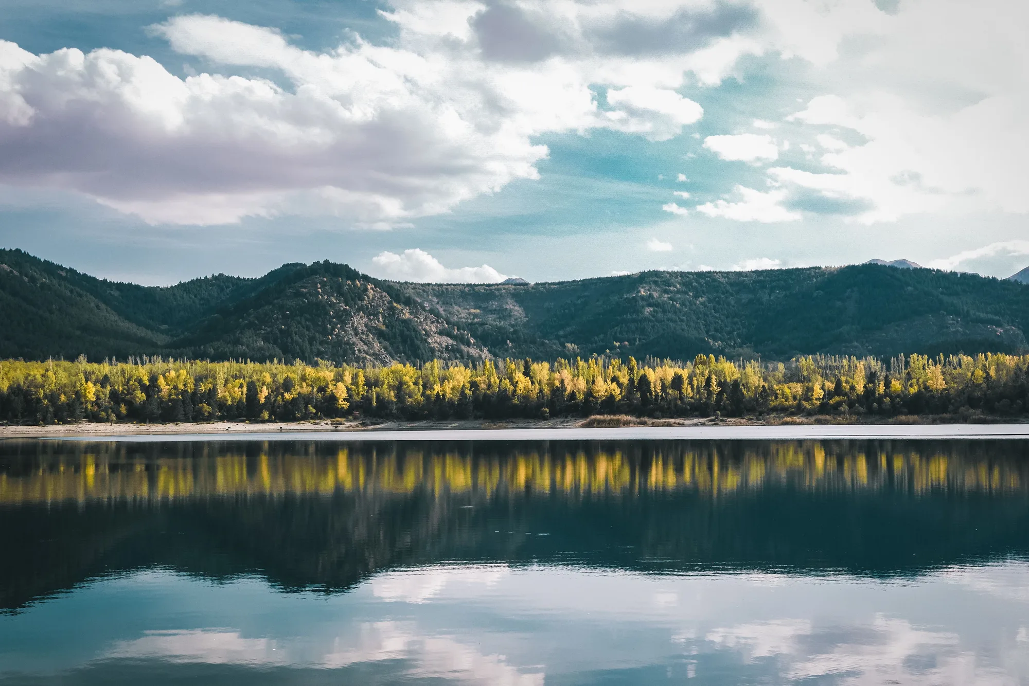A calm lake beneath the mountains