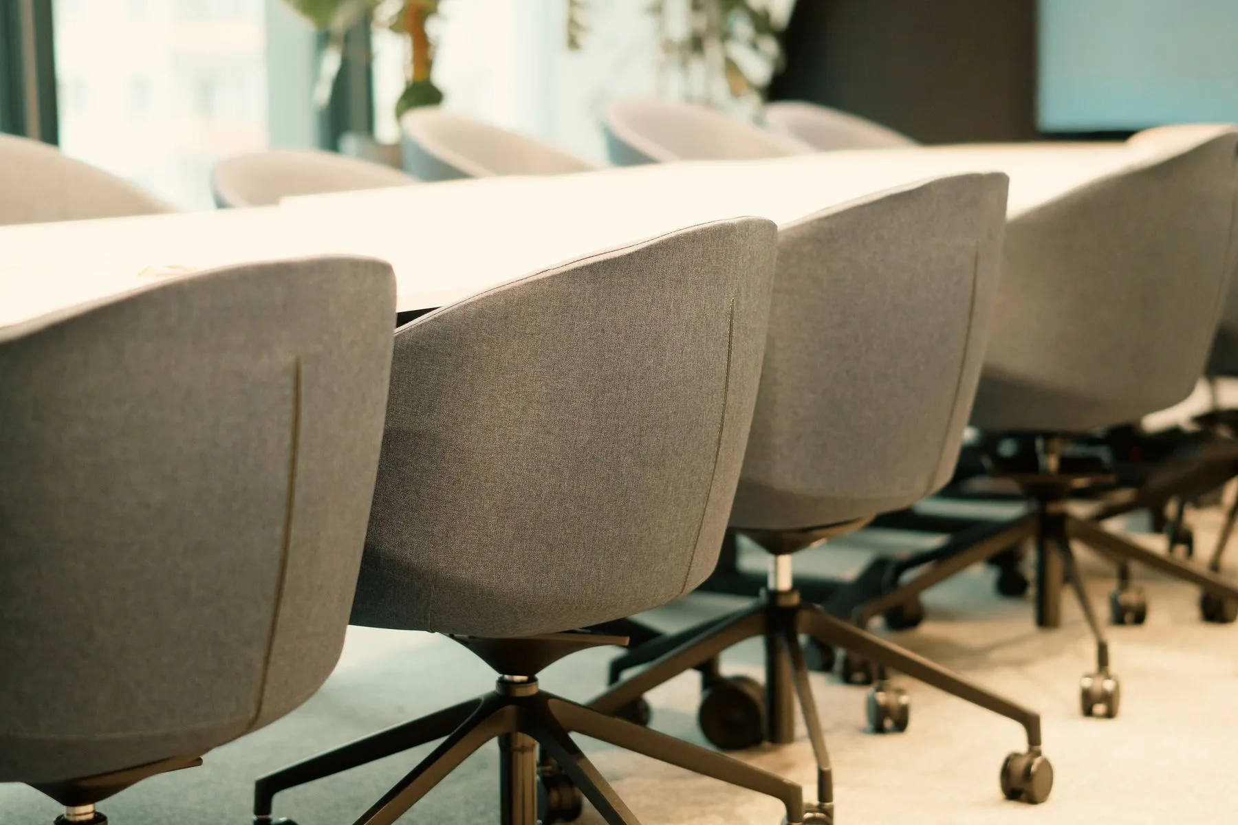 Empty chairs and a table in a modern meeting room