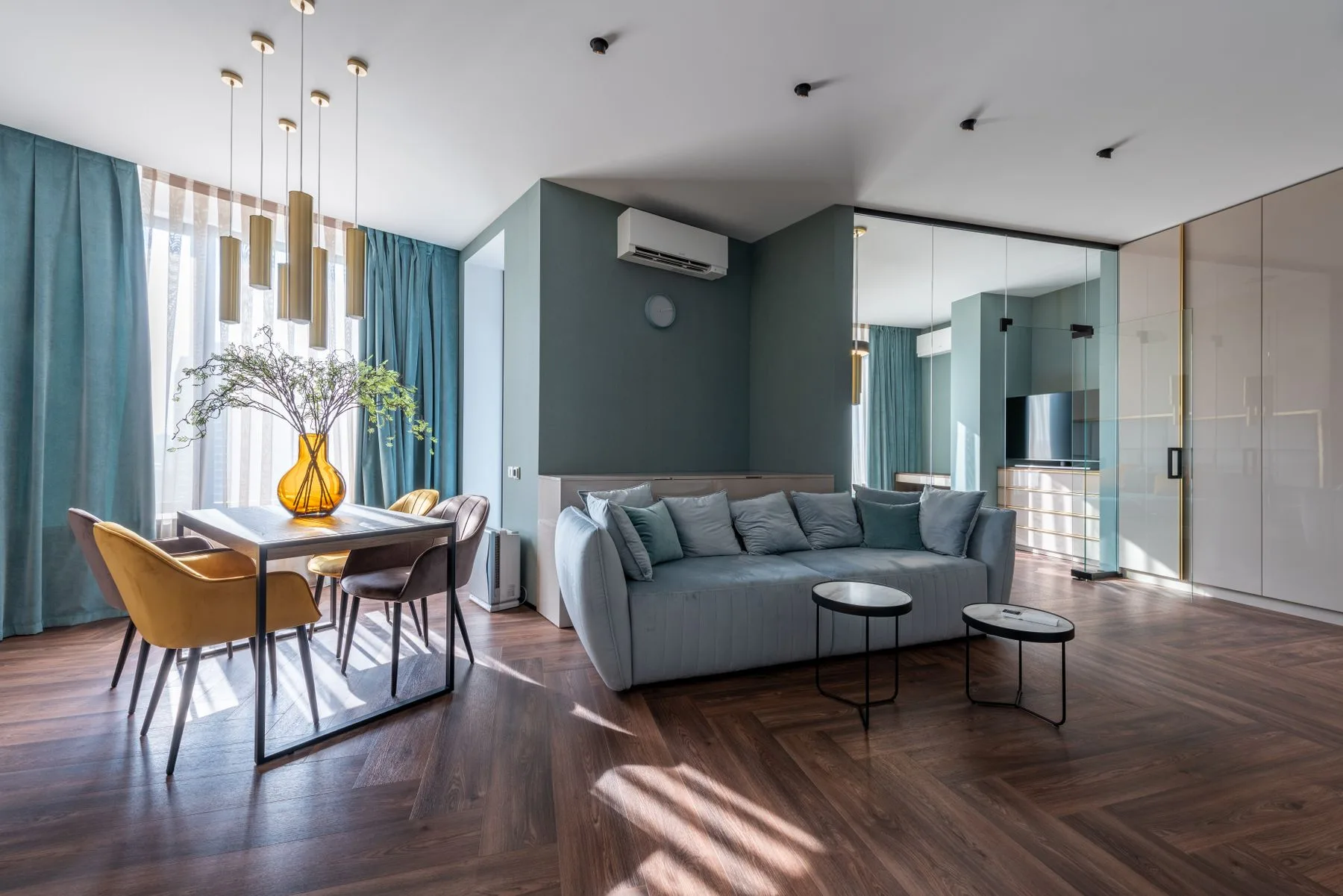 Open living and dining room with timber flooring