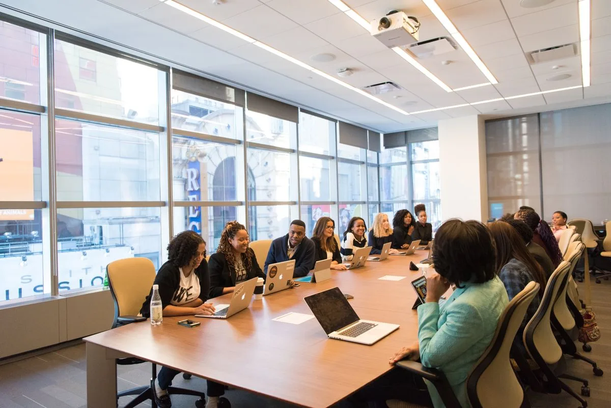 Modern corporate boardroom with a leadership team in discussion