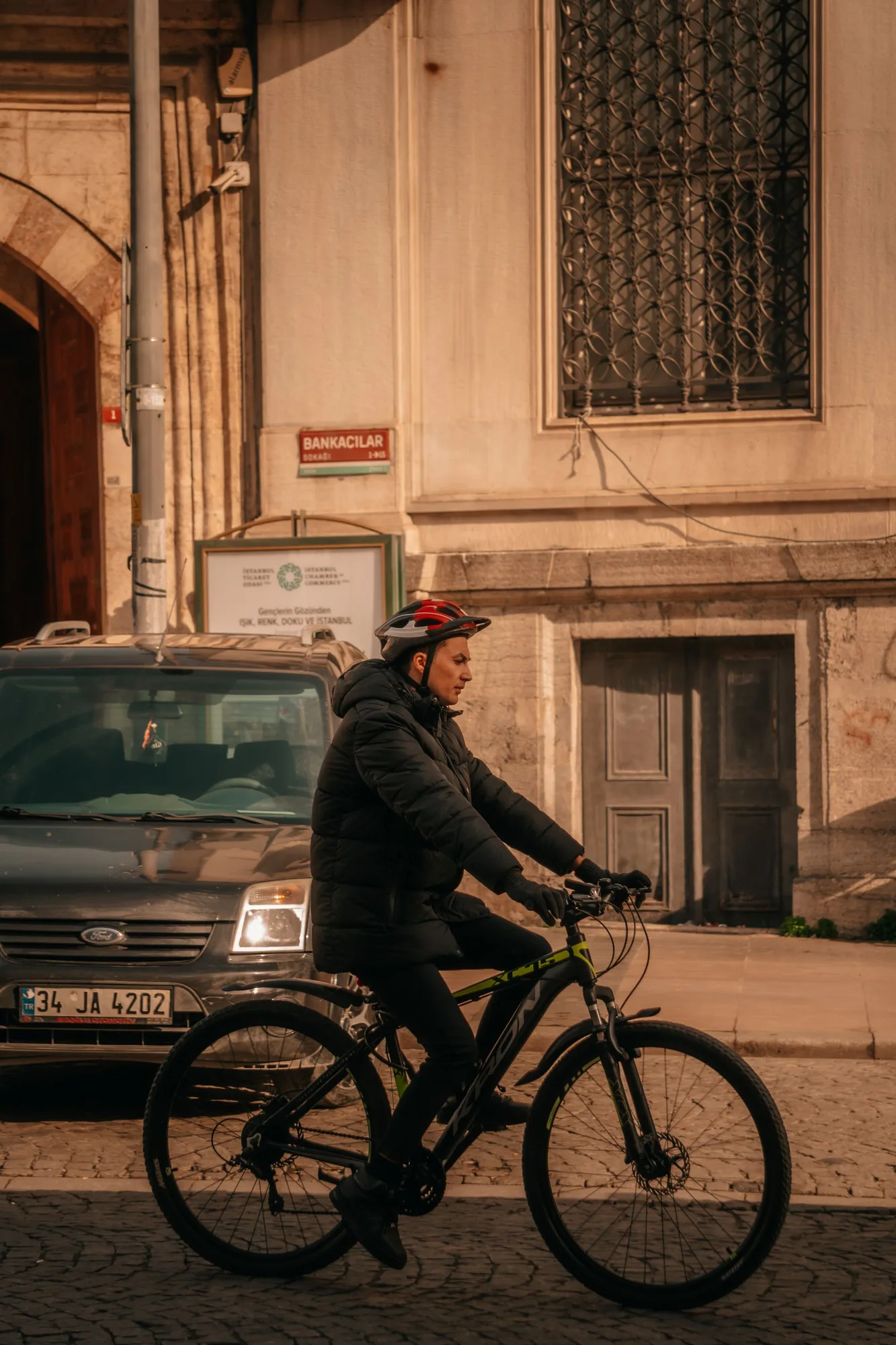 Cyclist riding through an urban street in Istanbul